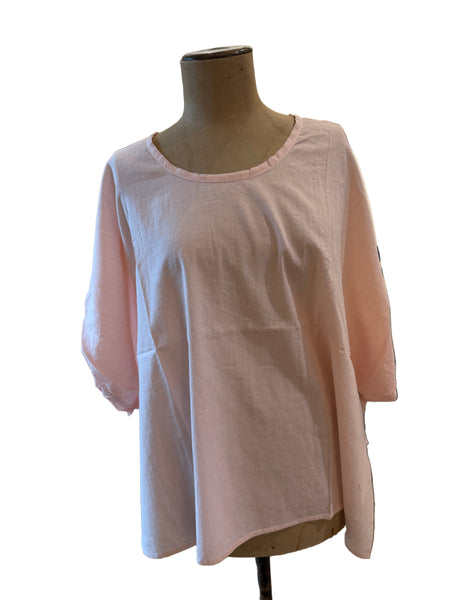 LOOM In the Pink short sleeve blouse in pale pink, front on a mannequin