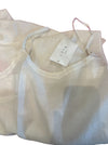 LOOM ivory silk and cotton slip laid flat with its LOOM swing tag