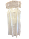 LOOM ivory silk and cotton slip dress on a hanger, full length