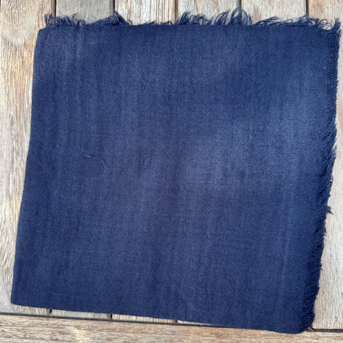 Manuelle Guibal Lowo fringed wool scarf in midnight blue, folded flat