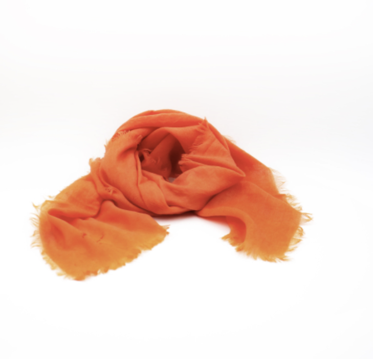 Manuelle Guibal Lowo fringed wool scarf in orange, loosely draped