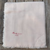 Manuelle Guibal Lowo fringed wool scarf in palest apricot, folded flat