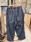 Manuelle Guibal Sata cotton worker pant in abyss navy, back view on hanger