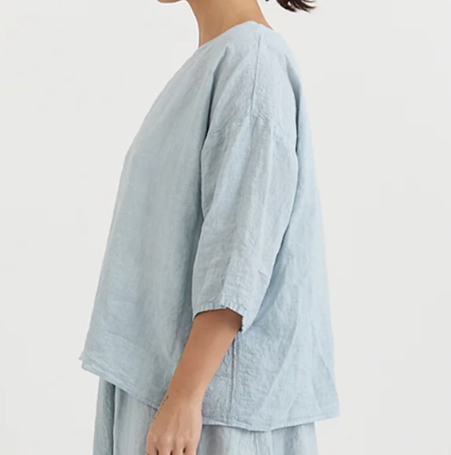 Manuelle Guibal Yilin simple linen tee blouse in ash pale blue, worn side view