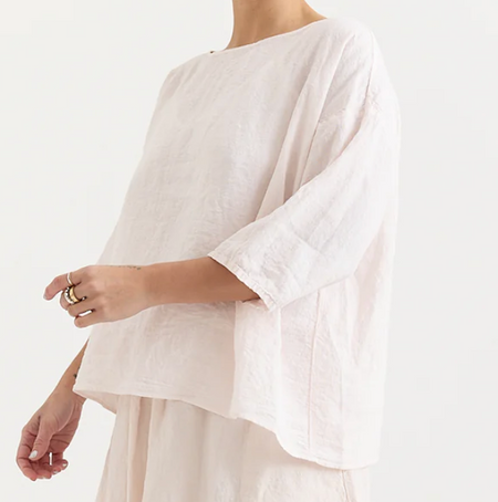 Manuelle Guibal Yilin simple linen tee blouse in pale blush, worn side view