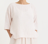Manuelle Guibal Yilin simple linen tee blouse in pale blush, worn front view