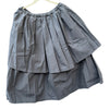 Manuelle Guibal Yizik tiered cotton skirt in metallic grey, front view on hanger