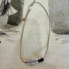 Mary Odorcic silk bracelet with pearl charm, brown silk with blue sapphires