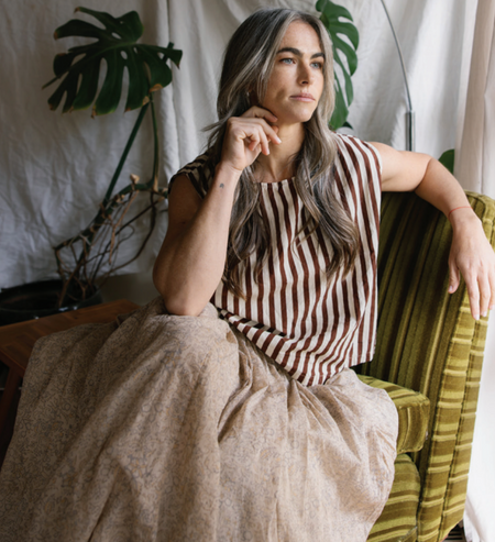 Metta Melbourne Anna sleeveless top in coco stripe, worn seated