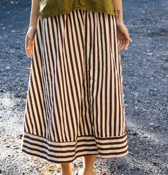 Metta Melbourne Ash A-line skirt in coco stripe, worn, hem detail