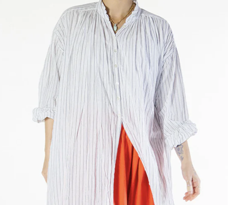 Metta Melbourne Bernadette smock dress in fine white stripe, worn open over a red skirt