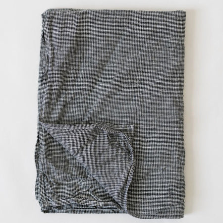 Metta Melbourne black houndstooth linen napkin, folded
