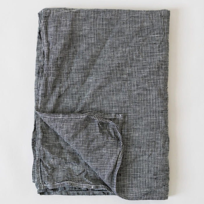 Metta Melbourne black houndstooth linen napkin, folded