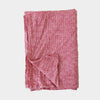 Metta Melbourne red houndstooth linen tea towel, folded