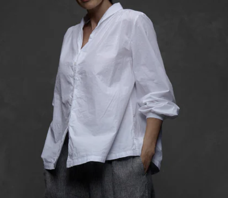 Metta Melbourne Pearl poplin shirt in white, worn with grey pants