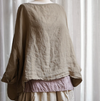 Metta Melbourne Sailor linen top in flax, worn over a pink slip
