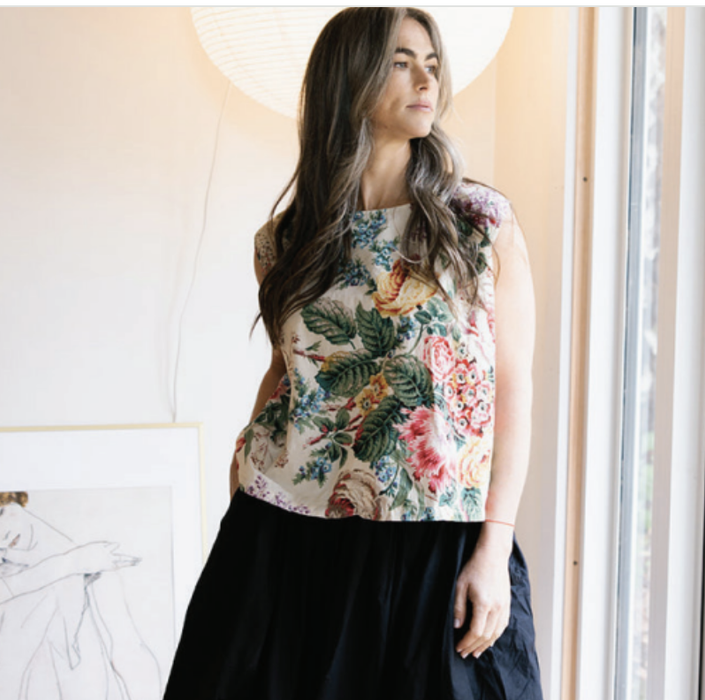 Metta Melbourne Ulla cotton poplin skirt in denim, worn with a floral sleeveless top