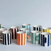 Musango handmade ceramic mugs in striped design, available in multiple colours including navy, orange, teal and yellow, made in Portugal