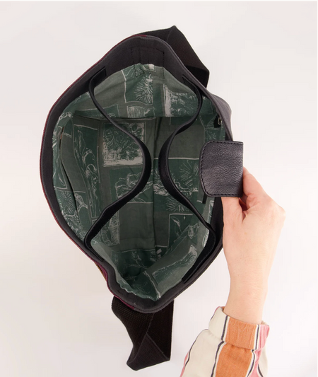 Inside the Nancybird Burton black leather bag with green printed lining