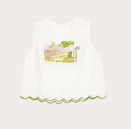Nancybird Moa white tank top with stamp print and green scalloped hem, flat lay