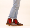 Duckfeet Roskilde brown leather chelsea boot with red elastic gusset worn with rolled light-wash jeans