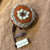 Sophie Digard applique wool flower brooch in rust with mint centre on wire stem