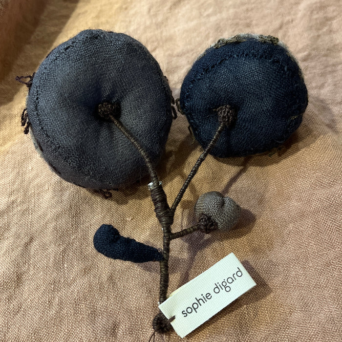 Sophie Digard carded wool brooch with two navy discs on a wire stem
