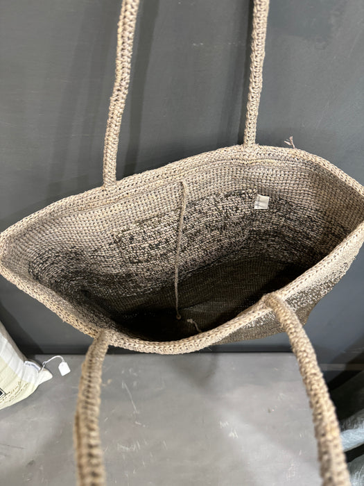 Inside view of the Sophie Digard moss raffia basket bag with crocheted lining and label