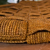 Close-up of the basket-weave pattern on the Sophie Digard mustard raffia tote