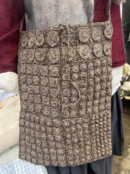 Sophie Digard Thorn crocheted tote shoulder bag in grey-brown, worn on the shoulder