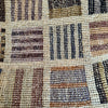 Close-up of the woven check panels on the Sophie Digard XL natural raffia basket bag
