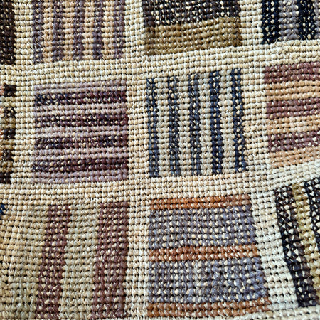 Close-up of the woven check panels on the Sophie Digard XL natural raffia basket bag