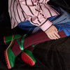 Tightology luxe wool tights in burgundy, worn with green platform shoes