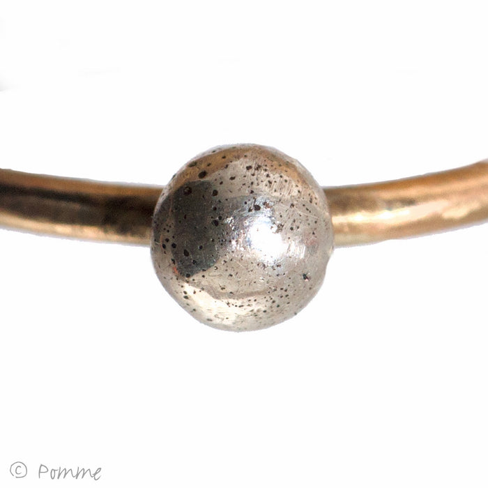 Fine gold ring with silver bobble