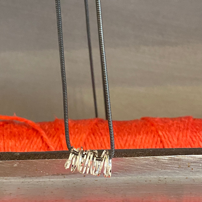 Anna Davern silver coil pendant long