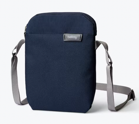 Bellroy City Pouch crossbody bag in navy with grey strap, front view