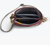 Inside the Bellroy City Pouch in plum, showing the internal pockets from above