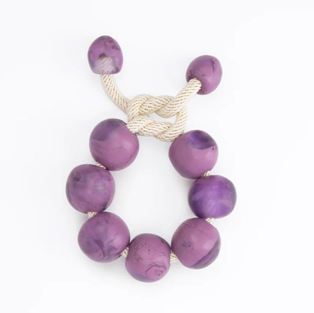 Dinosaur Designs Bold ball bracelet, grape purple resin beads on cream cord