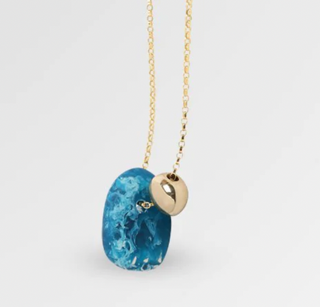 Dinosaur Designs Joie de vivre necklace, close-up of blue mineral resin pendant and gold bead