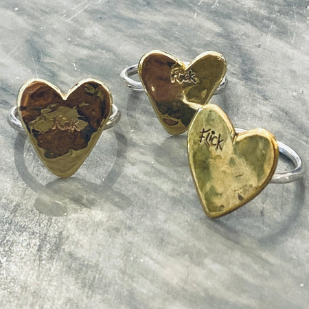 Flick Pope brass and silver heart rings, three together