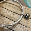 Katheryn Leopoldseder mermaid bangle with Tahitian pearl