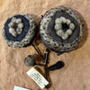 Two Sophie Digard applique and carded wool flower brooches in navy and grey